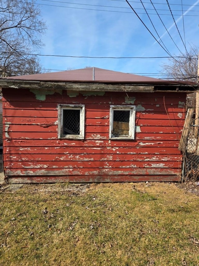 view of side of property with a yard