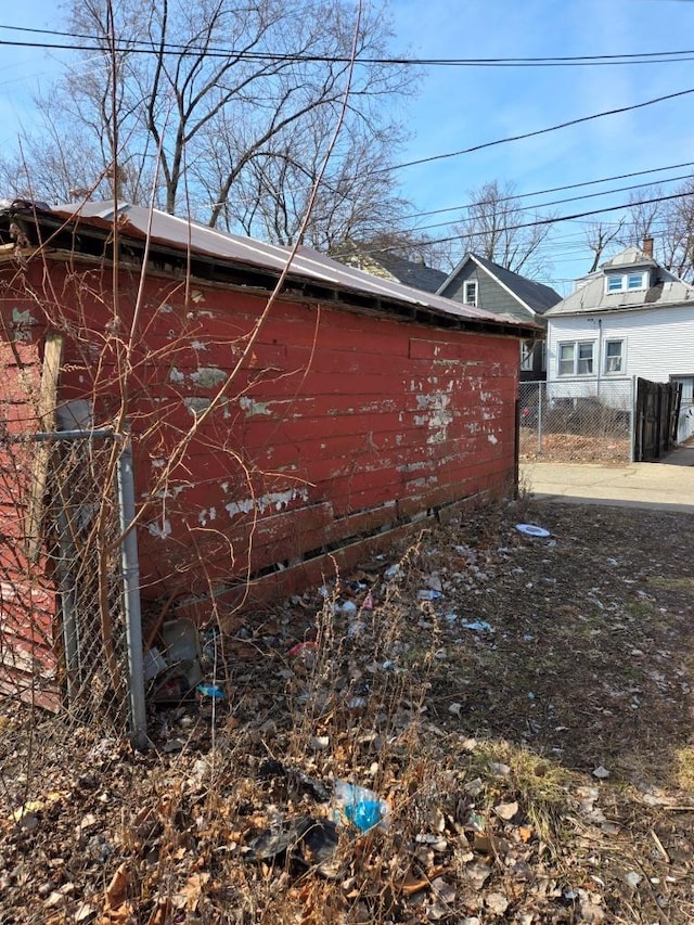 view of side of property featuring fence