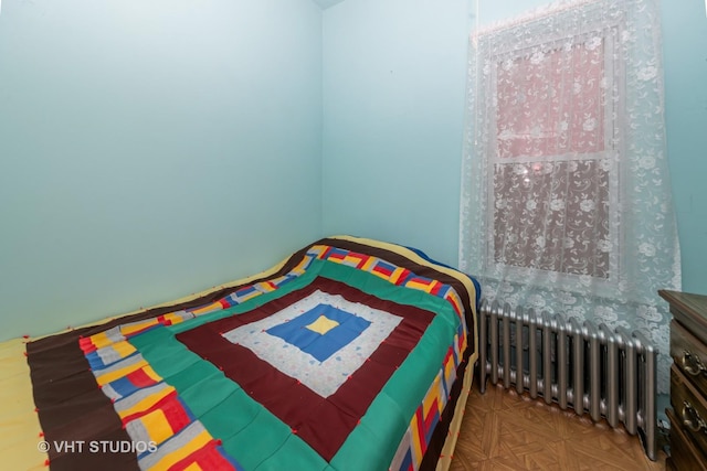 bedroom featuring radiator heating unit