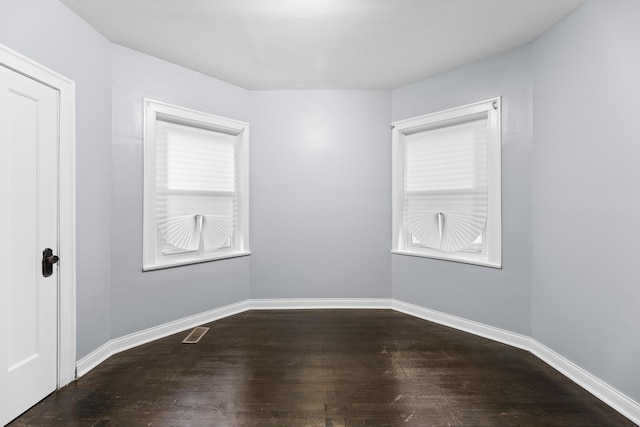 8025 S Evans Ave, Chicago, IL 60619 - spare room with visible vents, baseboards, and wood finished floors