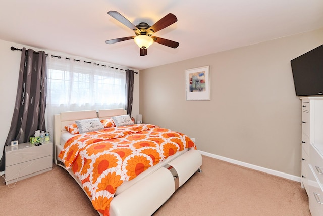 bedroom with baseboards, carpet, and ceiling fan