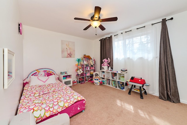 carpeted bedroom featuring a ceiling fan