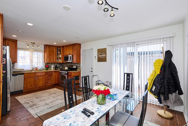 dining space featuring recessed lighting and dark wood-type flooring