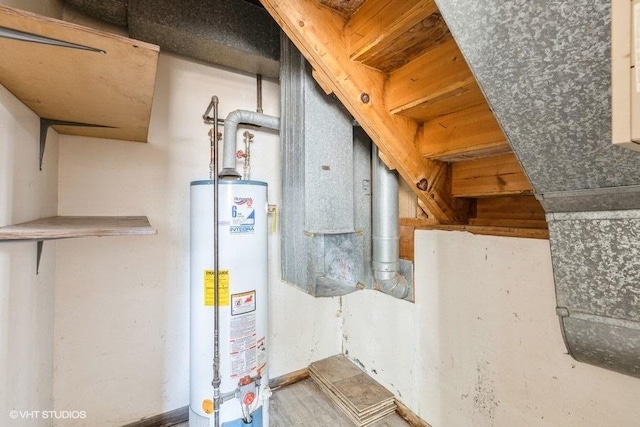 utility room with gas water heater