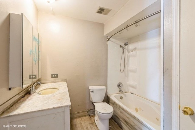 bathroom with visible vents, toilet, shower / tub combination, wood finished floors, and vanity