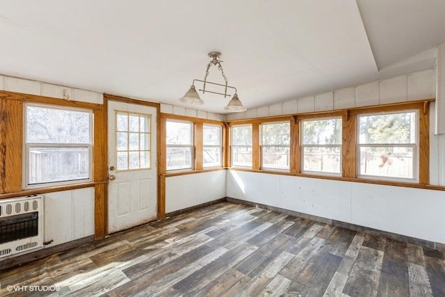 unfurnished sunroom featuring vaulted ceiling and heating unit