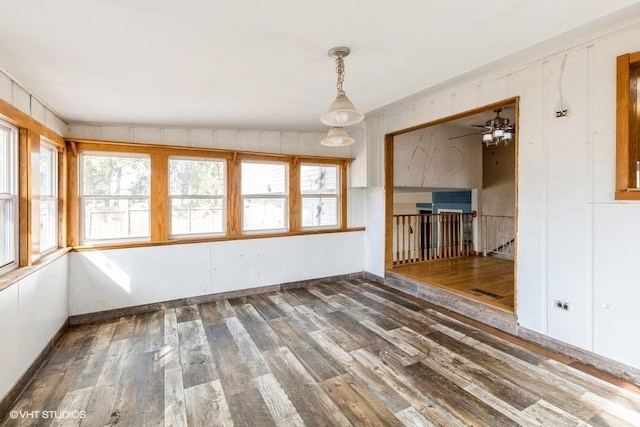 interior space with plenty of natural light and wood finished floors