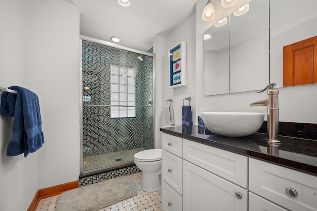 bathroom featuring vanity, baseboards, recessed lighting, a shower stall, and toilet