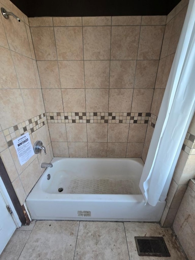 bathroom with visible vents, shower / bathtub combination with curtain, and tile patterned flooring