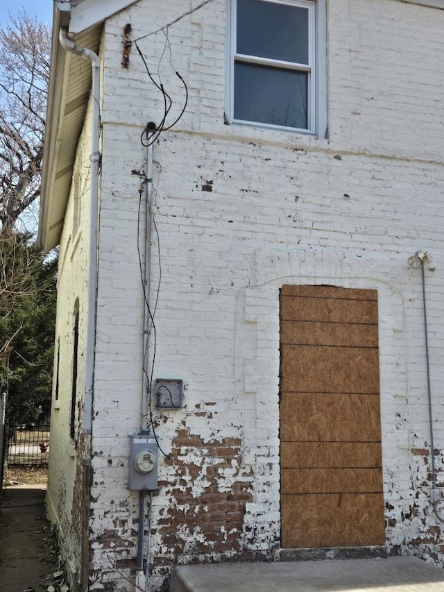 view of home's exterior with brick siding