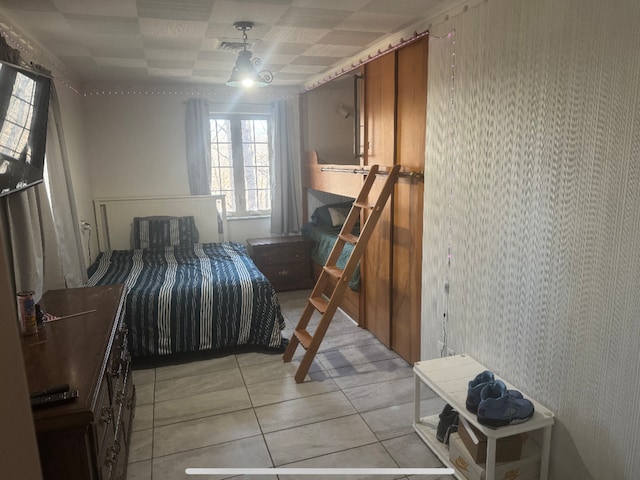 bedroom with light tile patterned flooring