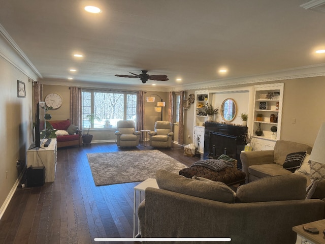 living room featuring baseboards, a fireplace, ornamental molding, and dark wood-style flooring