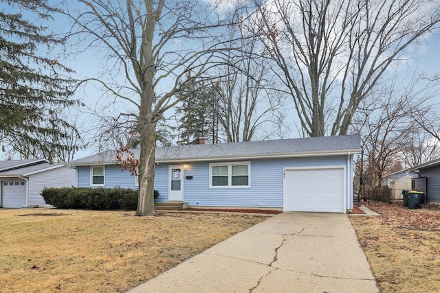 ranch-style home with concrete driveway, an attached garage, a front yard, and a chimney