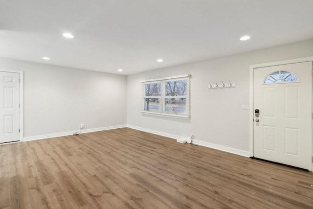 foyer with recessed lighting, baseboards, and wood finished floors