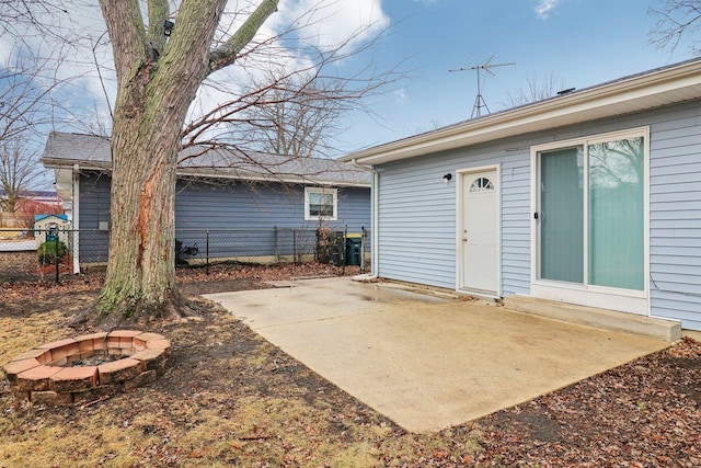 view of patio / terrace with an outdoor fire pit and fence