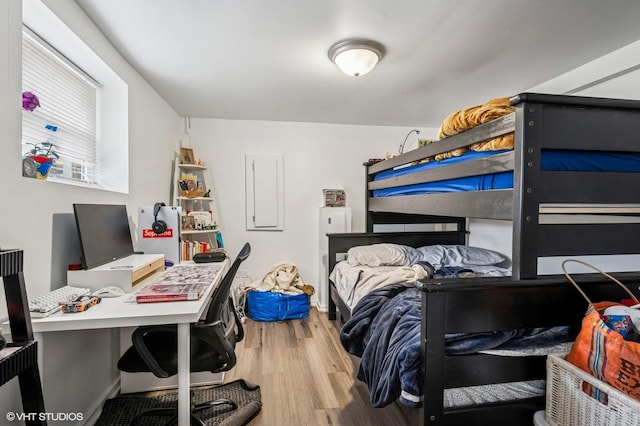 bedroom featuring wood finished floors