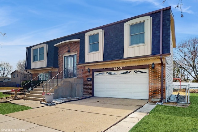 bi-level home with brick siding, mansard roof, and an attached garage