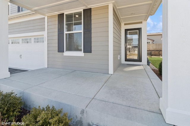 view of exterior entry featuring a garage