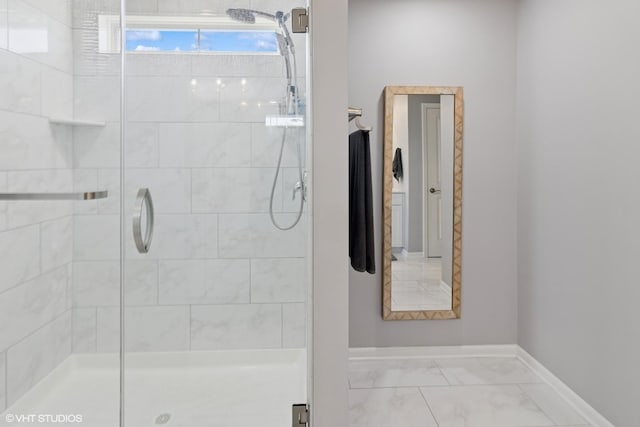 bathroom with a shower stall, baseboards, and marble finish floor