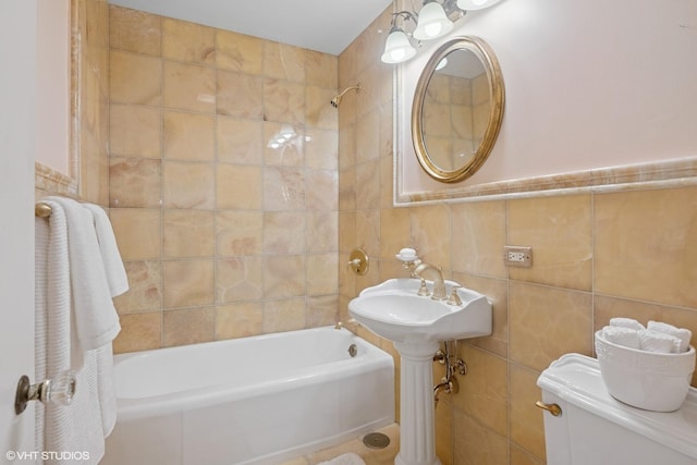 full bathroom featuring tile walls and  shower combination