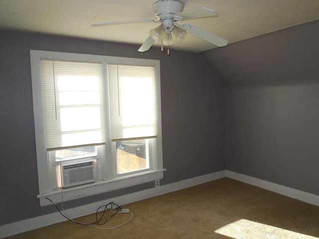 additional living space with cooling unit, baseboards, carpet floors, lofted ceiling, and ceiling fan