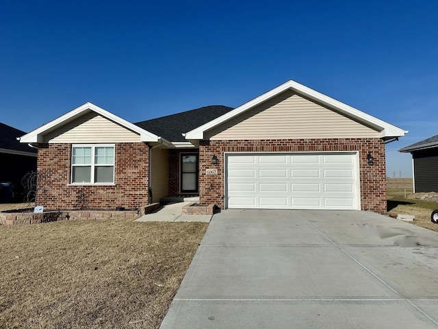 ranch-style house with concrete driveway, brick siding, and a garage
