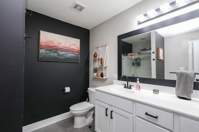 bathroom featuring visible vents, toilet, a shower stall, baseboards, and vanity