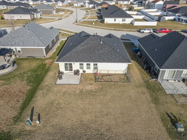 birds eye view of property with a residential view