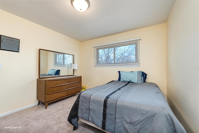 bedroom with baseboards and carpet floors