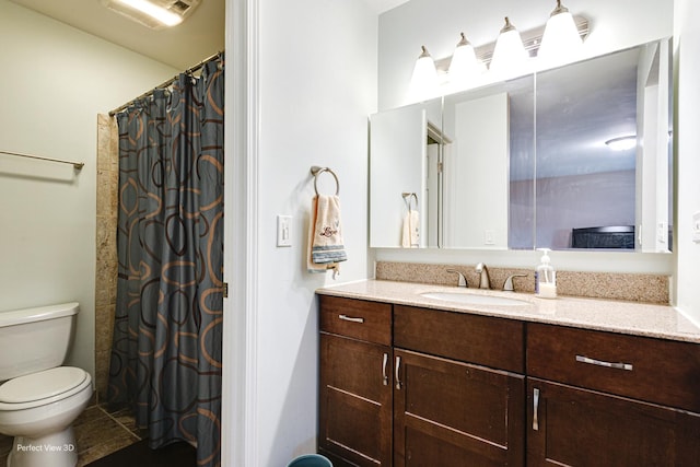 bathroom with visible vents, toilet, and vanity