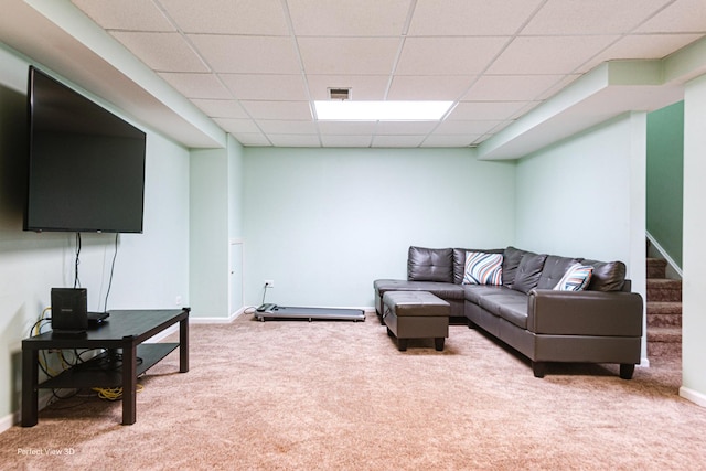 living area with stairway, baseboards, visible vents, and carpet floors