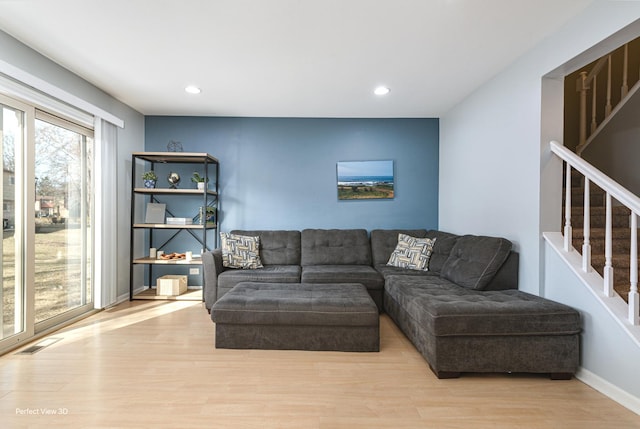 living room with stairway, wood finished floors, visible vents, baseboards, and recessed lighting