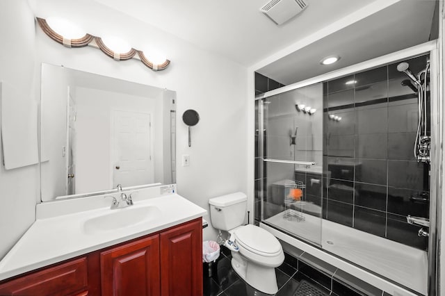 bathroom featuring vanity, visible vents, a stall shower, tile patterned floors, and toilet