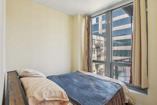 bedroom featuring multiple windows