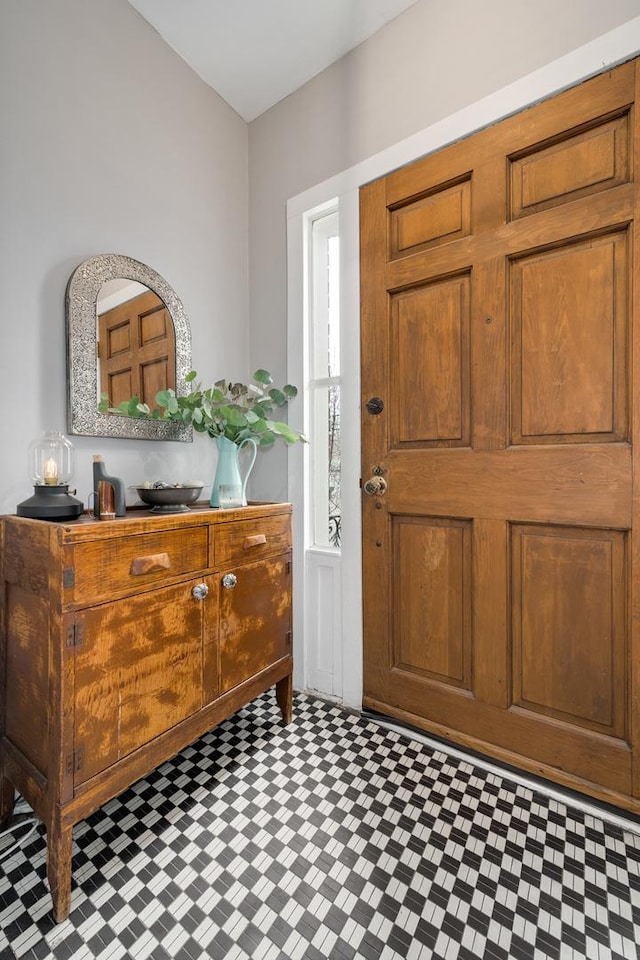 entryway with tile patterned floors