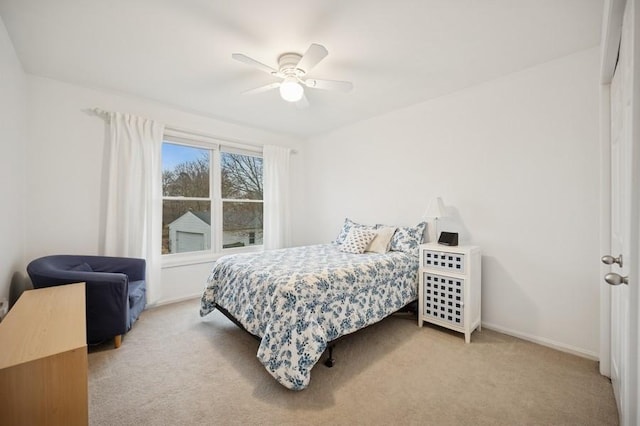 bedroom featuring baseboards, ceiling fan, and carpet flooring