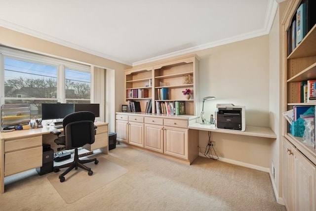 home office with light carpet, crown molding, and baseboards