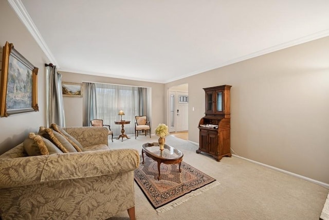 living area with ornamental molding, baseboards, and light carpet