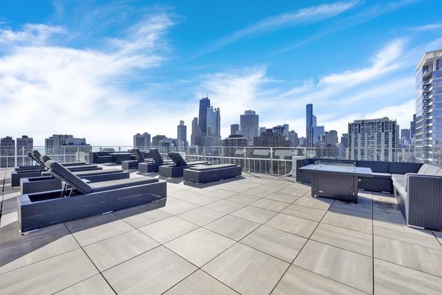 view of patio featuring an outdoor hangout area and a city view