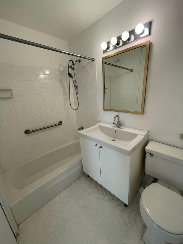 bathroom with tile patterned floors, washtub / shower combination, toilet, and vanity