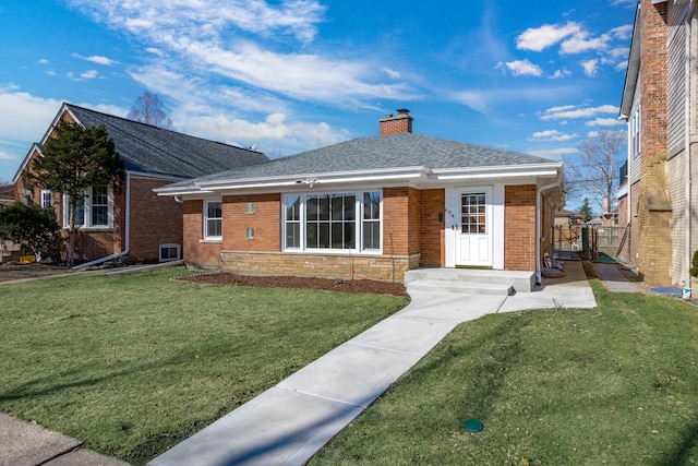 bungalow-style home with a front yard, brick siding, stone siding, and a chimney