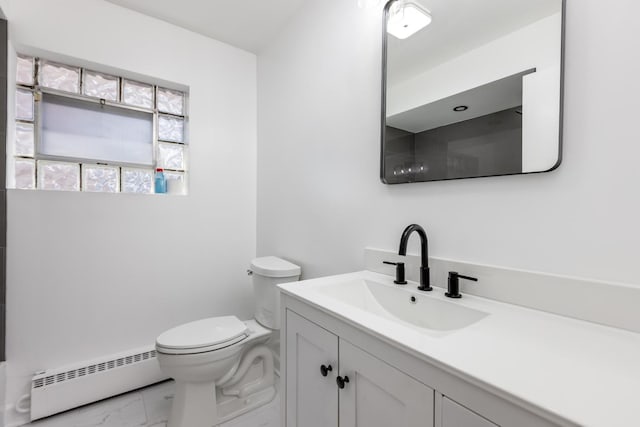 bathroom with baseboard heating, toilet, and vanity