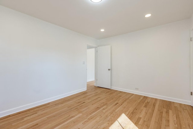 spare room with recessed lighting, baseboards, and light wood-style flooring