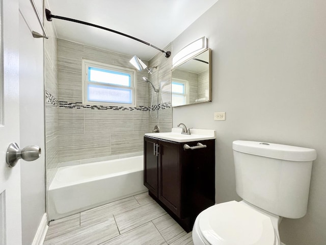 full bath featuring toilet, bathtub / shower combination, and vanity