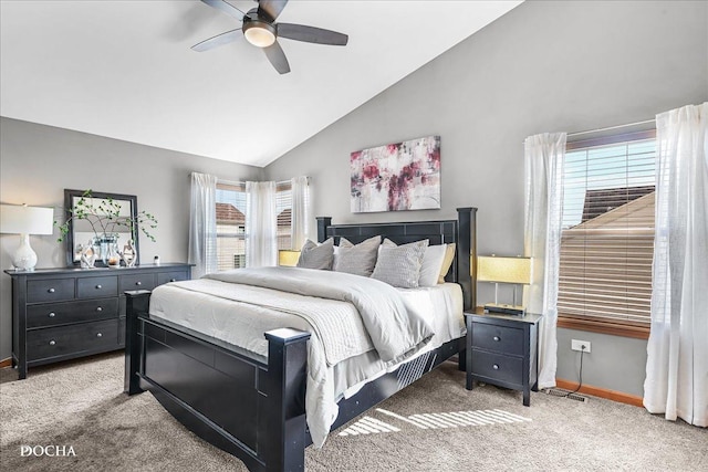 carpeted bedroom featuring a ceiling fan, baseboards, and vaulted ceiling