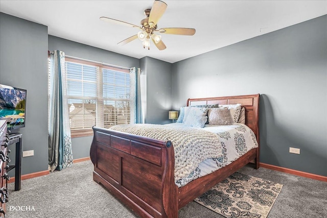 carpeted bedroom with baseboards and ceiling fan