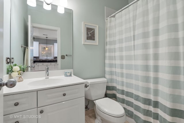 full bath featuring toilet and vanity