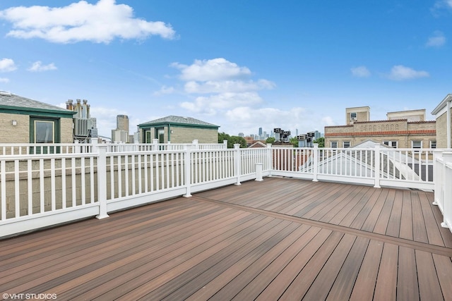 wooden terrace with a view of city