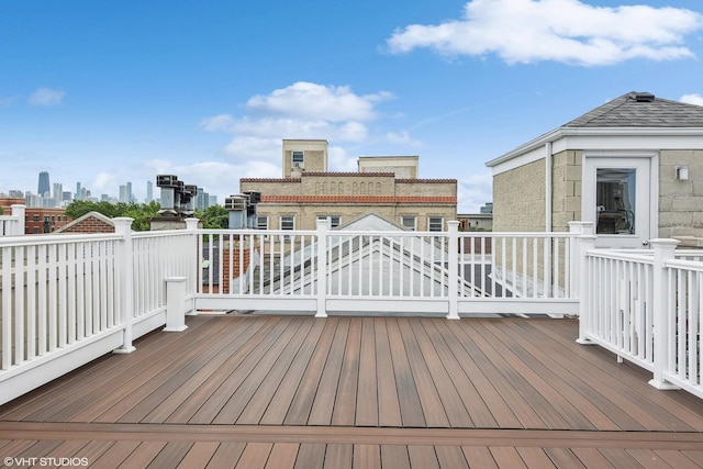 wooden terrace with a view of city