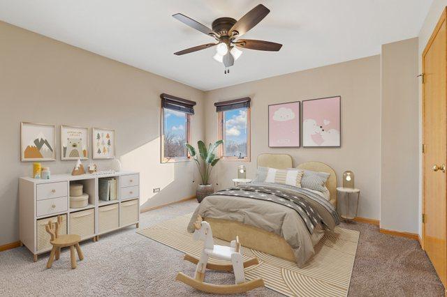 bedroom featuring light colored carpet, baseboards, and ceiling fan